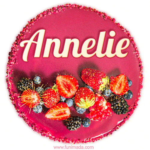 Beautifully decorated red velvet berry birthday cake with vibrant fruits and a glowing 'Annelie' name, adding a touch of sweetness and sparkle.