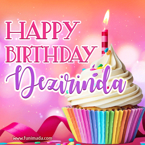 A vibrant birthday GIF featuring a rainbow-colored cupcake topped with white frosting, sprinkles, and a lit candle. The text reads 'Happy Birthday Dezirinda' in bold pink and violet letters with white outline.