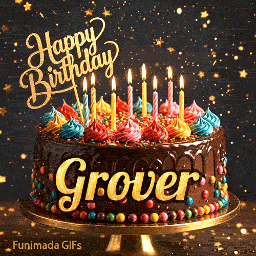 A chocolate drip birthday cake on a stand with colorful frosting and lit candles, featuring the name Grover in glowing yellow letters.