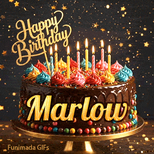 Elegant yellow script spelling Marlow on a chocolate glaze birthday cake with glowing multicolored candles.