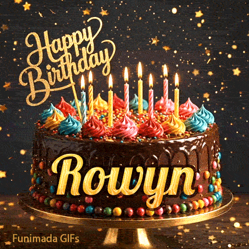 Gold Happy Birthday topper and lit candles on a chocolate frosted cake with Rowyn's name on a dark starry background.