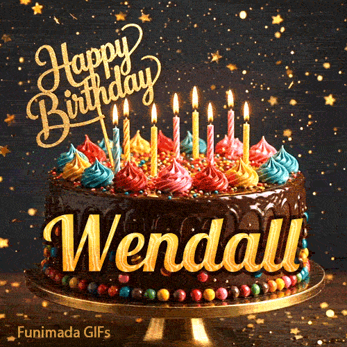 Close-up of a chocolate birthday cake with multi-colored frosting swirls, lit candles, and a glittering gold Happy Birthday sign with name Wendall