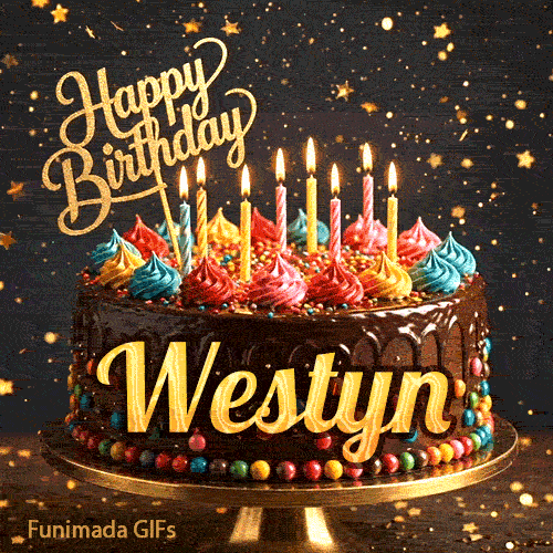 Shimmering golden particles around a chocolate frosted birthday cake with lit candles and the name Westyn.