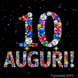 Il numero 10 e l'espressione Auguri disegnati da gioielli brillanti multicolori, circondati da piccole scintille su uno sfondo scuro.