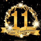 Il numero 11 è circondato da un anello dorato brillante, accompagnato da un nastro elegante con la scritta 'Buon Compleanno!' su uno sfondo scuro.