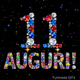 Animazione con il numero 11 e la parola Auguri creati da pietre preziose colorate, con un effetto scintillante su sfondo nero.