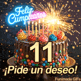 El número 11 en color dorado sobre una tarta decorada. Letras luminosas de Feliz Cumpleaños resaltan entre chispas de bengala y estrellas que caen.
