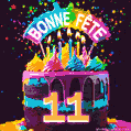 Gâteau au chocolat avec le numéro 11 orné d'un glaçage vibrant, de bougies et d'une décoration arc-en-ciel