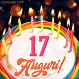 Un'animazione celebrativa di una torta di compleanno per i 17 anni, Le fiamme delle candeline tremolano e delle scintille brillano intorno, creando un'atmosfera festosa e magica.