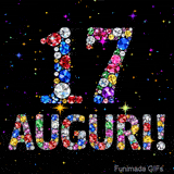 Il numero 17 e la scritta Auguri formati da gemme colorate e scintillanti su uno sfondo nero animato da piccole stelle luminose.