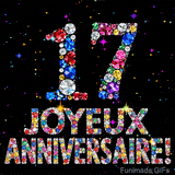 Le chiffre 17 et les mots Joyeux Anniversaire formés de diamants colorés étincelants sur fond noir avec de petites étoiles scintillantes animées.