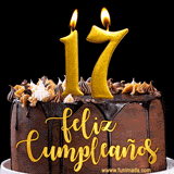 GIF de un pastel de chocolate con decoración de crema, velas doradas con el número 17 encendido, y un fondo negro elegante y cálido.