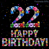 The number 22 and the phrase Happy Birthday composed of shiny glittering precious stones, set against a dark canvas animated with little glowing color stars.