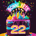 Gâteau au chocolat avec le numéro 22 orné d'un glaçage vibrant, de bougies et d'une décoration arc-en-ciel