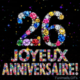Le chiffre 26 et l'inscription Joyeux Anniversaire dessinés par des joyaux brillants multicolores, entourés de petites étincelles sur fond sombre.