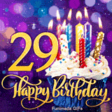 Golden number 29 and Happy Birthday script with a frosted cupcake topped with lit candles on a glowing, blurry purple lighted background.