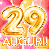 Bouquet animato di palloncini multicolori che emergono da una scatola regalo, con il numero 29 e la scritta 'Tanti Auguri!' su uno sfondo pieno di coriandoli.