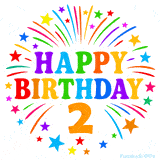 Festive 'Happy Birthday 2' animated GIF with rainbow-colored letters surrounded by fireworks and stars