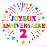 GIF animé joyeux anniversaire 2 ans avec étoiles multicolores et feu d’artifice