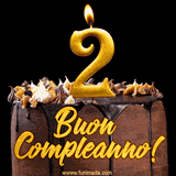 GIF animato con una torta al cioccolato decorata con crema, dettagli dorati e due candele accese che formano il numero 2. Messaggio 'Buon Compleanno' in scritta elegante.