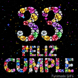 Gráfico del número 33 junto al texto FELIZ CUMPLE. Las letras y dígitos consisten enteramente en joyas de tonos vibrantes sobre fondo negro.