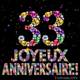 Le chiffre 33 et les mots Joyeux Anniversaire formés de diamants colorés étincelants sur fond noir avec de petites étoiles scintillantes animées.
