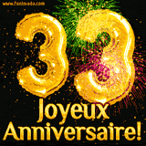 GIF animé pour un 33e anniversaire avec des ballons dorés en forme de 33, des feux d'artifice colorés et le texte 'Joyeux Anniversaire!' sur un fond noir festif.