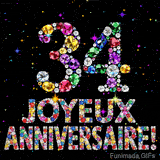 Le chiffre 34 et l'inscription Joyeux Anniversaire dessinés par des joyaux brillants multicolores, entourés de petites étincelles sur fond sombre.