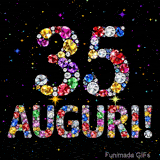 Animazione con il numero 35 e la parola Auguri creati da pietre preziose colorate, con un effetto scintillante su sfondo nero.