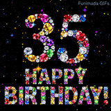 The number 35 alongside the words Happy Birthday, crafted from glittering multi-colored gemstones, glowing against a pitch-black background with tiny color sparks.