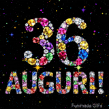 Immagine che mostra il numero 36 e il testo Auguri composti da cristalli luminosi di vari colori su una tela nera piena di stelle animate.