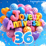 Des mots en ballons colorés formant Joyeux Anniversaire flottent dans la brise, accompagnés du grand chiffre bleu 36 attaché aux fils.