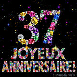 Sur un fond sombre, le chiffre 37 et Joyeux Anniversaire sont formés par des diamants multicolores, accompagnés de petites étoiles scintillantes.