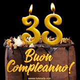 GIF animato con una torta al cioccolato decorata con crema, dettagli dorati e due candele accese che formano il numero 38. Messaggio 'Buon Compleanno' in scritta elegante.