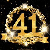 Il numero 41 è circondato da un anello dorato brillante, accompagnato da un nastro elegante con la scritta 'Buon Compleanno!' su uno sfondo scuro.