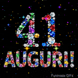 Il numero 41 e la scritta Auguri formati da gemme colorate e scintillanti su uno sfondo nero animato da piccole stelle luminose.