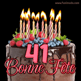 GIF animé pour un 41e anniversaire avec un somptueux gâteau au chocolat décoré de baies fraîches, des bougies allumées et le texte '41 Bonne Fête!' en rouge.