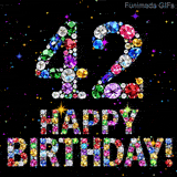 On a dark space, the number 42 and Happy Birthday phrase are built using colorful glittering jewels, accompanied by tiny animated twinkling bright shining stars.