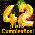 ¡Muy felices 42 años! GIF de texto dorado y fuegos artificiales.
