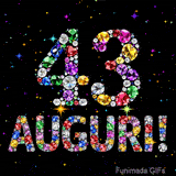Animazione con il numero 43 e la parola Auguri creati da pietre preziose colorate, con un effetto scintillante su sfondo nero.