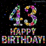 The number 43 alongside the words Happy Birthday, crafted from shimmering multi-colored gemstones, shining against a pitch-black canvas with tiny color sparks.