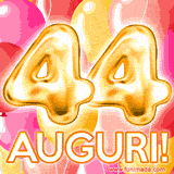 Bouquet animato di palloncini multicolori che emergono da una scatola regalo, con il numero 44 e la scritta 'Tanti Auguri!' su uno sfondo pieno di coriandoli.