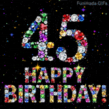 A black backdrop displaying the number 45 and Happy Birthday text, both formed by shiny multi-colored diamonds surrounded by tiny twinkling bright colored lights.