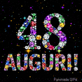 Immagine animata che mostra il numero 48 e Auguri in cristalli multicolori brillanti, circondati da piccole luci su uno sfondo scuro.