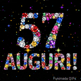 Il numero 57 e la scritta Auguri formati da gemme colorate e scintillanti su uno sfondo nero animato da piccole stelle luminose.