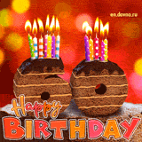 60th birthday GIF featuring a chocolate cake on bokeh background shaped as the number 60, with colorful lit candles on top. Happy Birthday text appears below in a bold font and pink, orange and red colors.