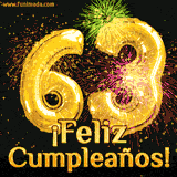 GIF animado con globos dorados en forma del número 63, acompañado de fuegos artificiales de colores y la frase '¡Feliz cumpleaños!' en letras vibrantes.