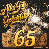 Die goldene Ziffer 65 steht prominent auf einem Schokokuchen. Umgeben ist sie von einer Wunderkerze und herabrieselndem goldenen Konfetti.
