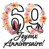 Ce GIF de Joyeux 69ème Anniversaire présente le nombre vingt rempli d'un bouquet vibrant de fleurs animées, avec des papillons qui bougent doucement sur un fond blanc.
