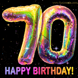 Shiny number 70 birthday celebration balloons with an iridescent glow and glitter on a black background with twinkling stars.